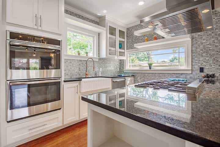 An image of a modern kitchen with sleek appliances, featuring a gas stove, refrigerator, and built-in microwave in Bradenton